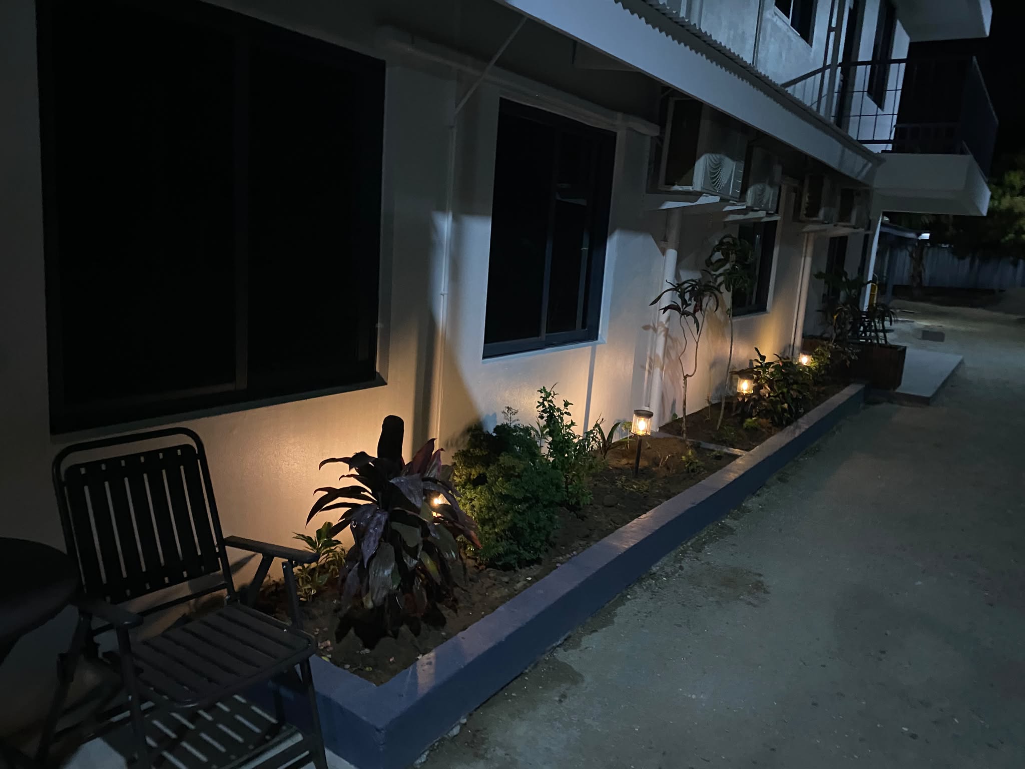 The apartments and garden after dark