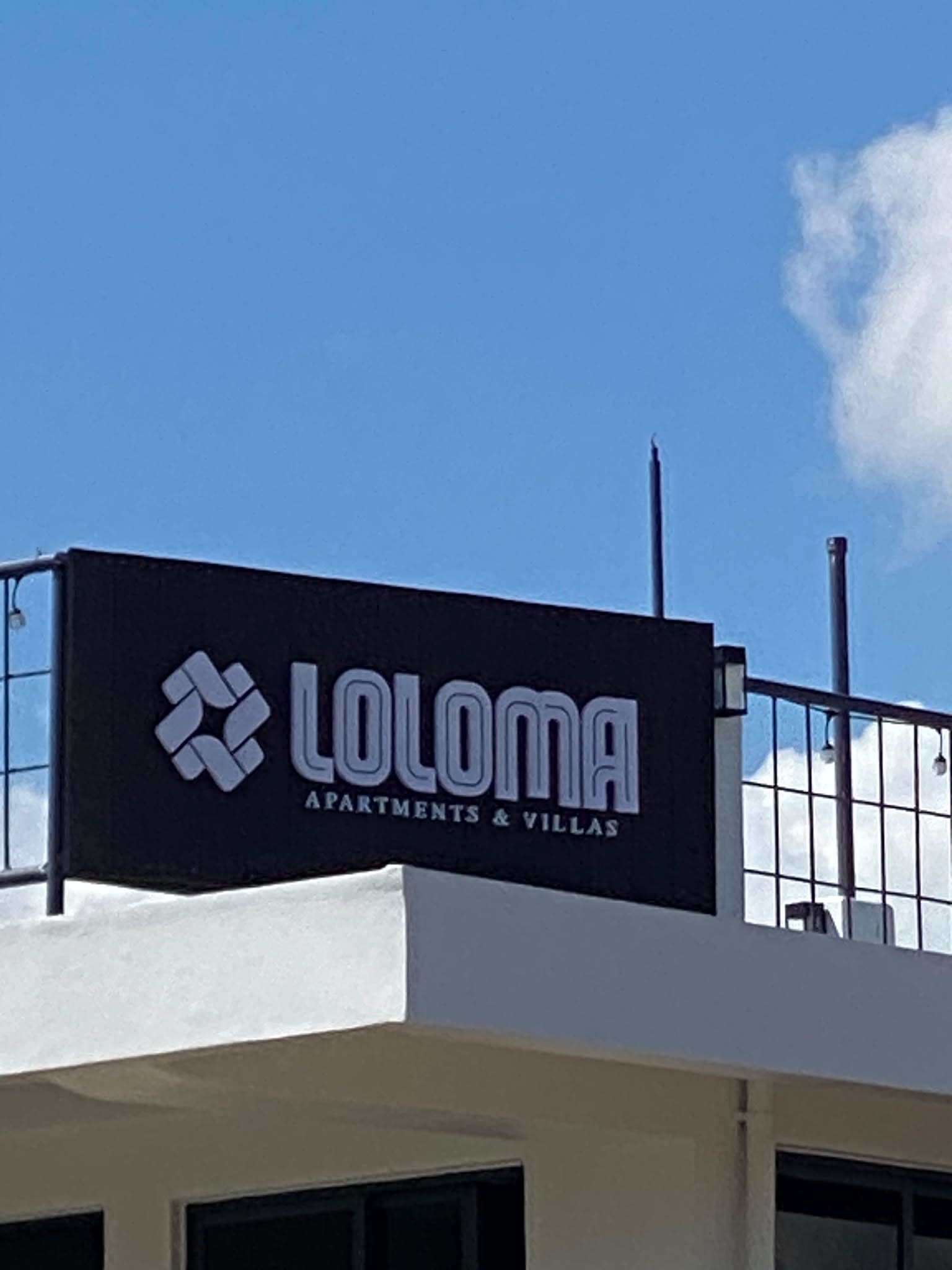 Loloma rooftop and apartment signage
